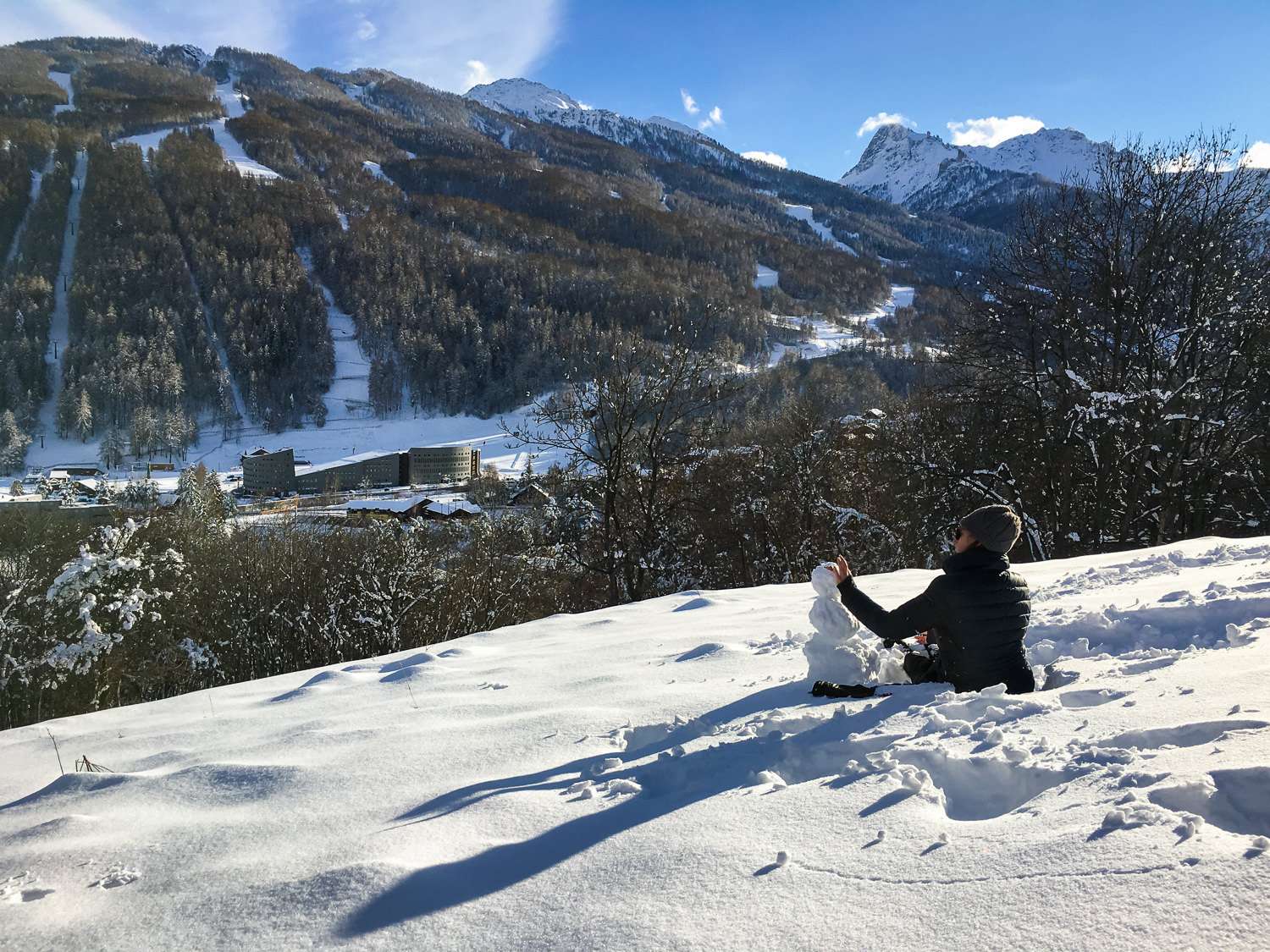 Making a Snowman in the Italian Alps in Winter.