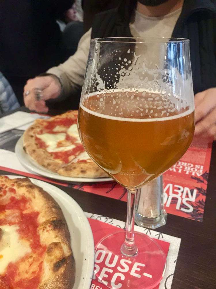 Eating Italian pizza Beer and forks